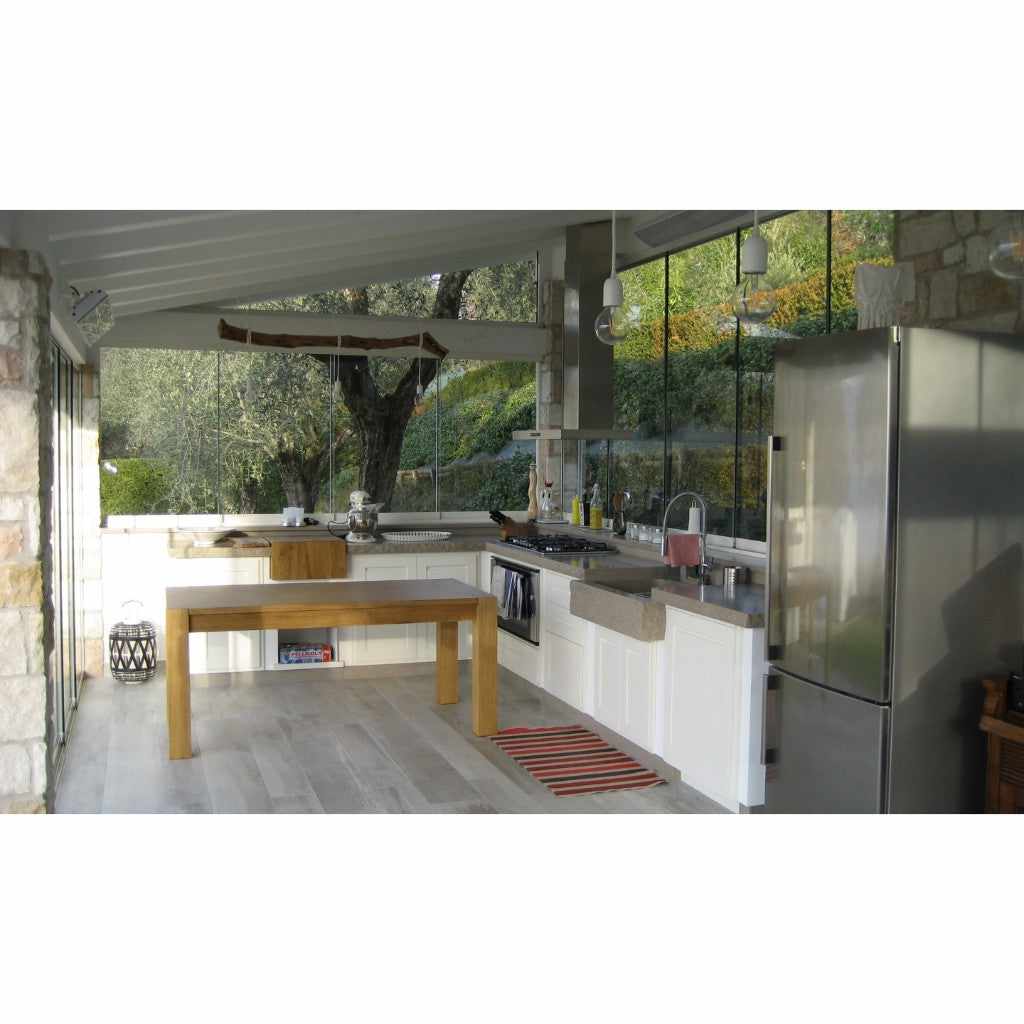 Heatscope Heaters Vision 3200w electric radiant heater mounted on the ceiling of a modern, glass-walled kitchen.