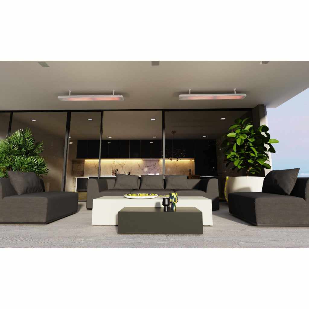 Two Heatscope Vision 3200w electric radiant heaters mounted on a modern outdoor patio ceiling above grey lounge furniture.
