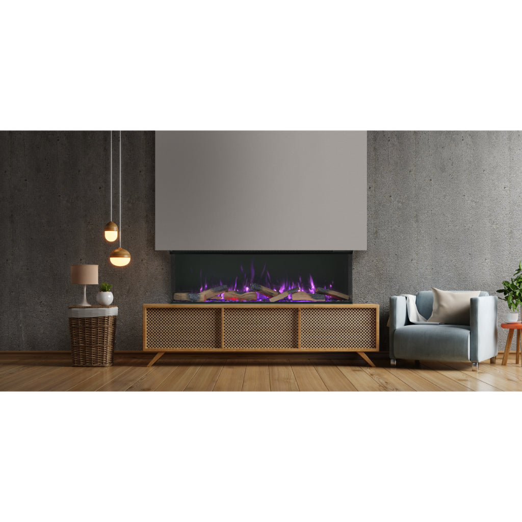 Vision Futura 1300 electric fire with purple flames in a wooden media unit against a grey concrete-effect wall.