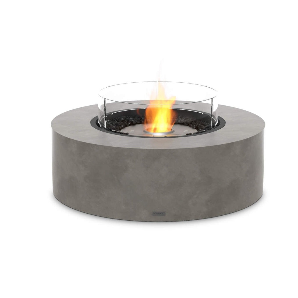 EcoSmart Fire Ark 40 bioethanol fire pit with a grey concrete-effect circular base and glass wind guard.