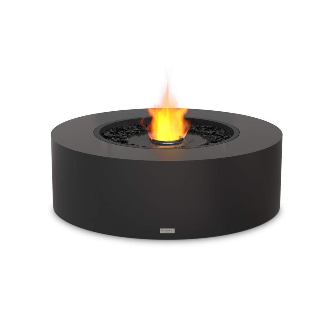 EcoSmart Fire Ark 40 bioethanol fire pit table in matte black with a central flame and decorative black stones.