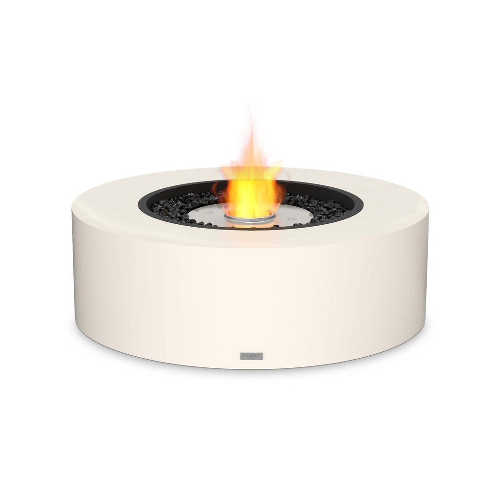EcoSmart Fire Ark 40 bioethanol fire pit table in cream with a central flame and black decorative stones.