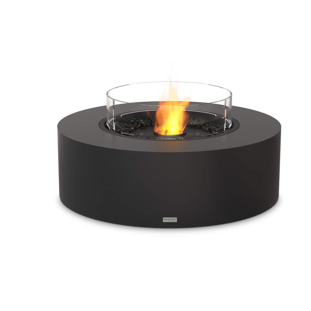 EcoSmart Fire Ark 40 bioethanol fire pit table in matte black with a circular glass screen and central flame.