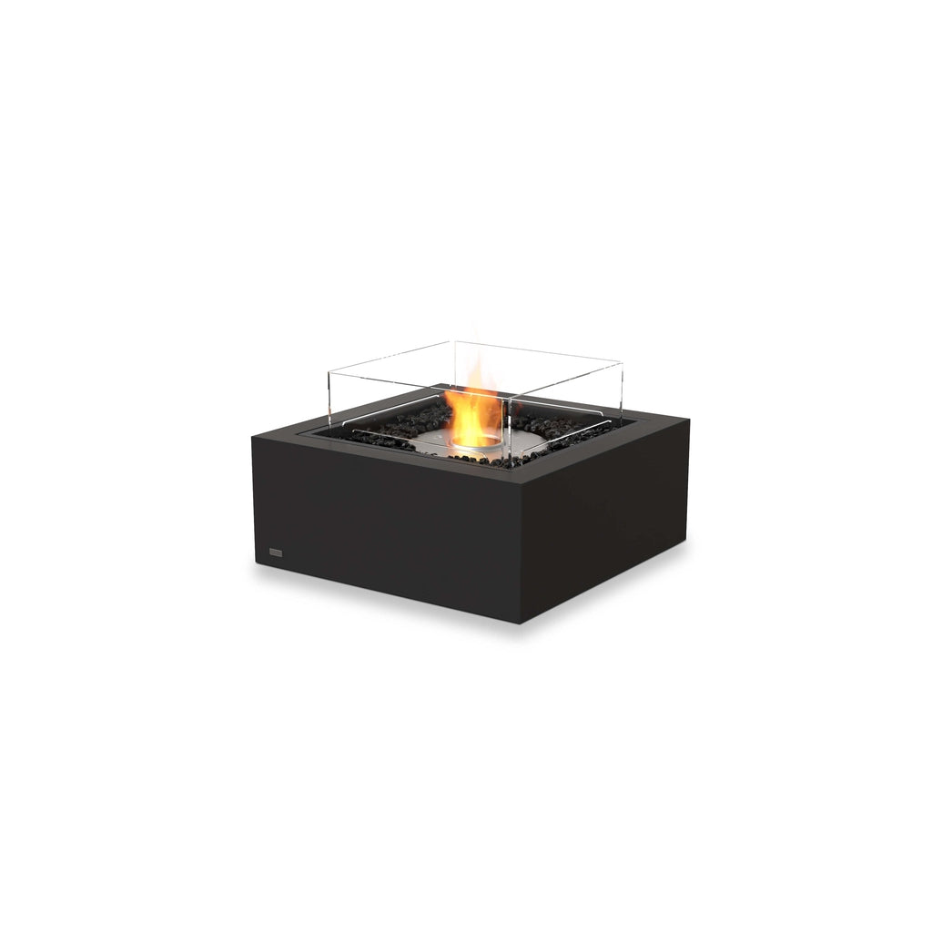 EcoSmart Fire Base 30 bioethanol fire pit table in matte black with a square glass screen and burning flame.