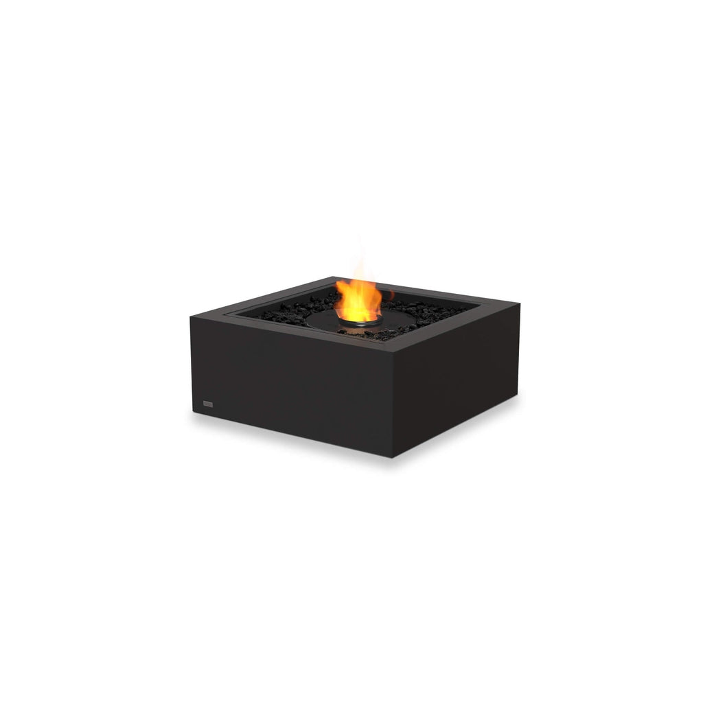EcoSmart Fire Base 30 bioethanol fire pit in matte black with a square frame and central flame over black lava rocks.