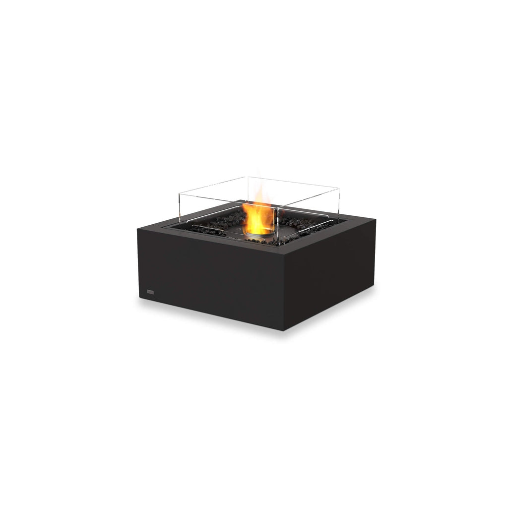 EcoSmart Fire Base 30 bioethanol fire pit in black with a square glass screen and glowing central flame.