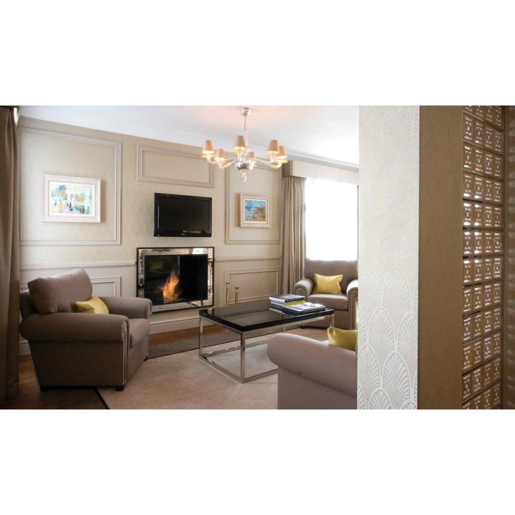 EcoSmart Fire BK5 ethanol burner installed in a mirrored fireplace surround within a traditional beige living room.