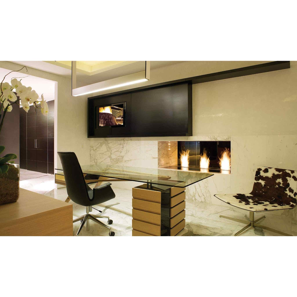 EcoSmart Fire BK5 ethanol burner integrated into a white marble fireplace wall in a modern office setting.