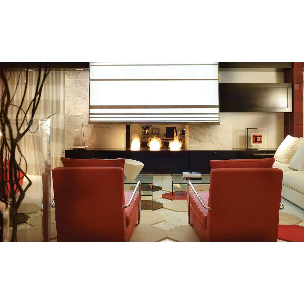 EcoSmart Fire BK5 ethanol burner with three flames set in a modern black fireplace within a contemporary living room.