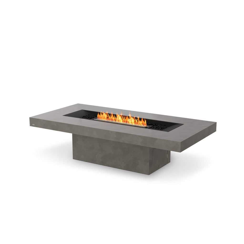 EcoSmart Fire Gin 90 bioethanol fire pit table in grey concrete with a central linear flame and black decorative stones.