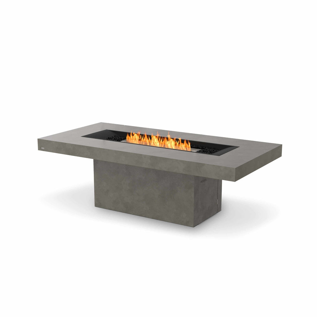 EcoSmart Fire Gin 90 dining fire pit table in grey concrete with a central linear flame and black decorative stones.