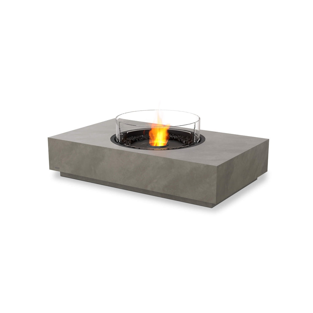 EcoSmart Fire Martini 50 bioethanol fire pit table in grey concrete with a circular glass screen and central flame.