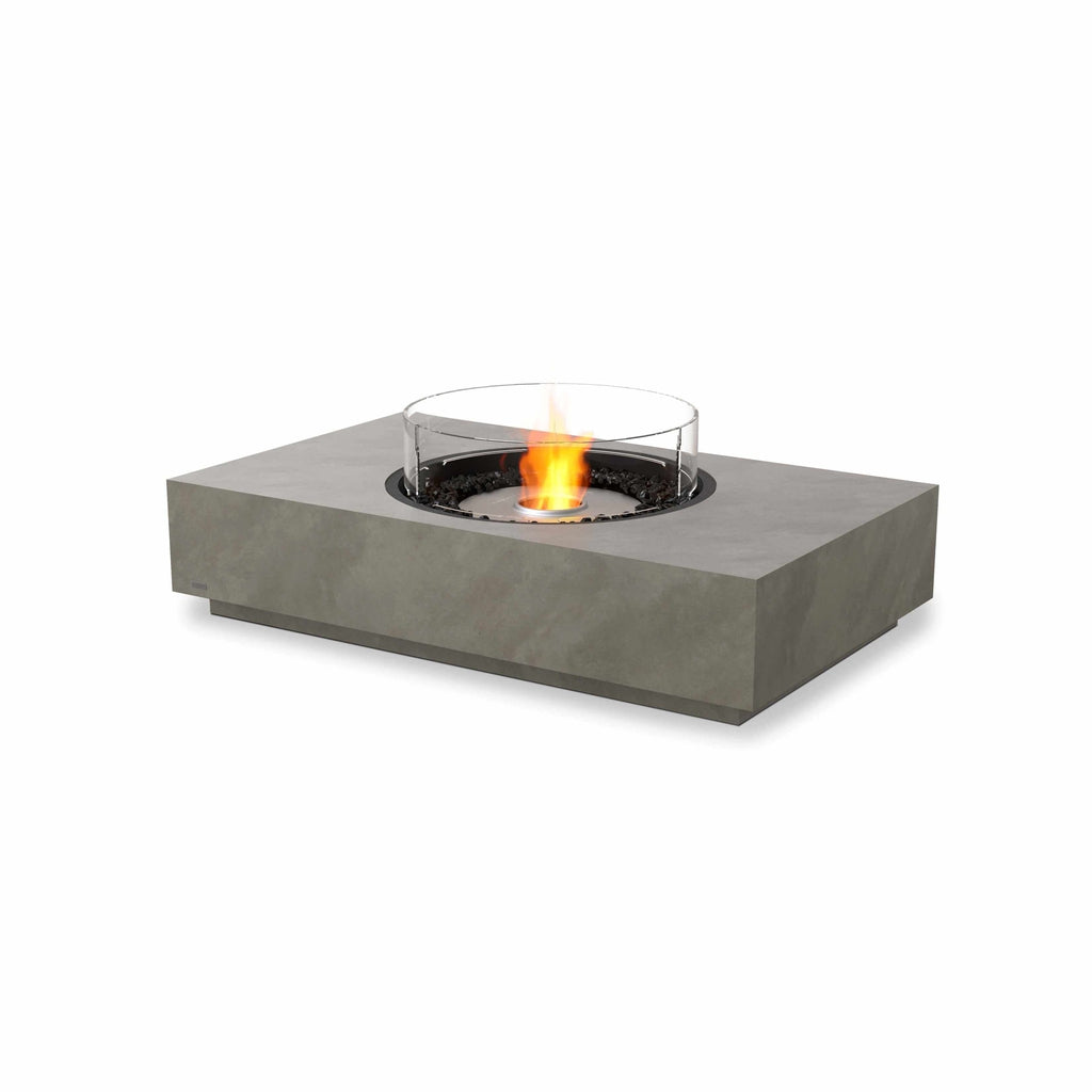 EcoSmart Fire Martini 50 bioethanol fire pit table in grey concrete with a circular glass screen and central flame.