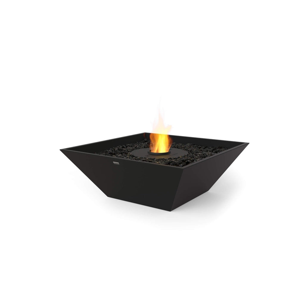 EcoSmart Fire Nova 850 bioethanol fire pit with a black square bowl, dark decorative stones, and a central flame.
