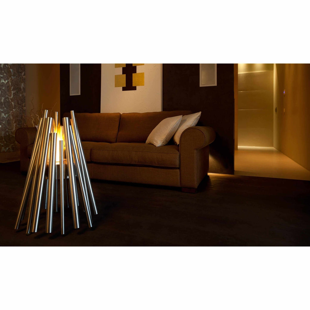 EcoSmart Fire Stix bioethanol fire pit with stainless steel rods arranged in a cone shape in a modern living room.