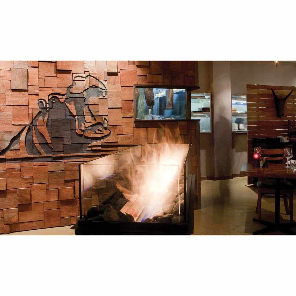 EcoSmart Fire XS340 ethanol burner with glass sides, black base, and decorative stones in a modern restaurant setting.
