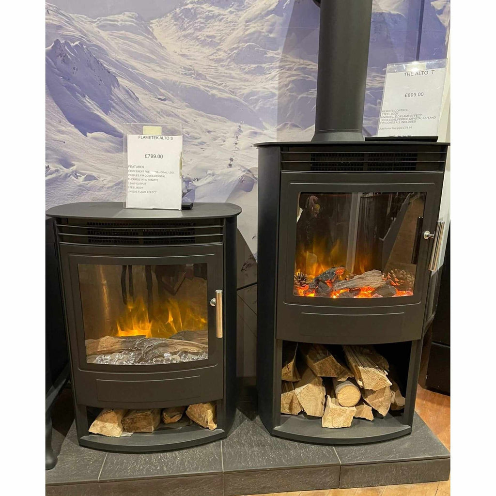 Flametek Alto T electric stove in black with a glass door, glowing log fuel effect, and a lower log storage compartment.
