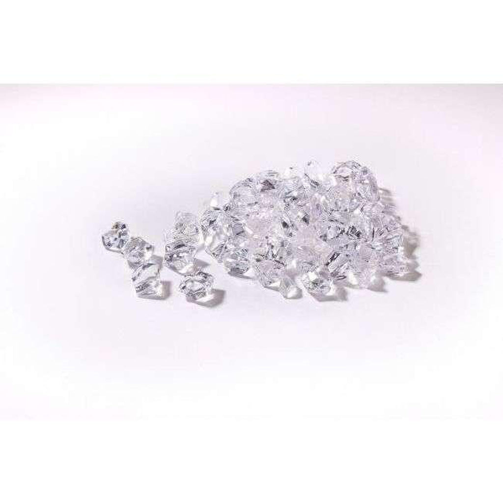 A pile of clear, faceted acrylic crystal fuel bed pieces for the Flametek Capella Electric Stove Suite.