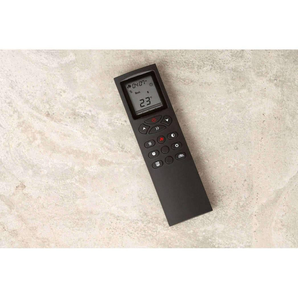 Black Flametek Midi Electric Fireplace Suite remote control with an LCD screen and button interface on a stone surface.