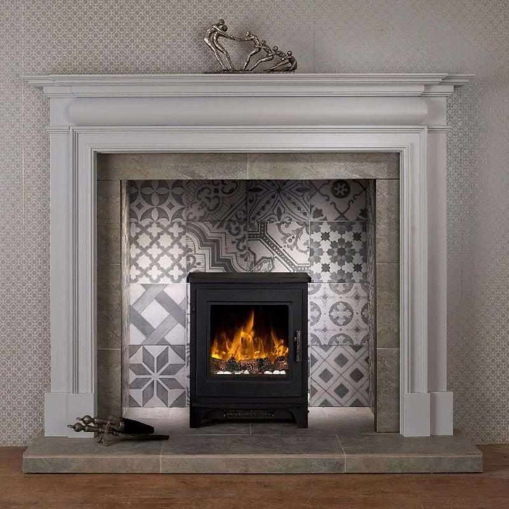 Flametek Milo electric stove in black, set within a white mantelpiece against a patterned tile fireplace surround.