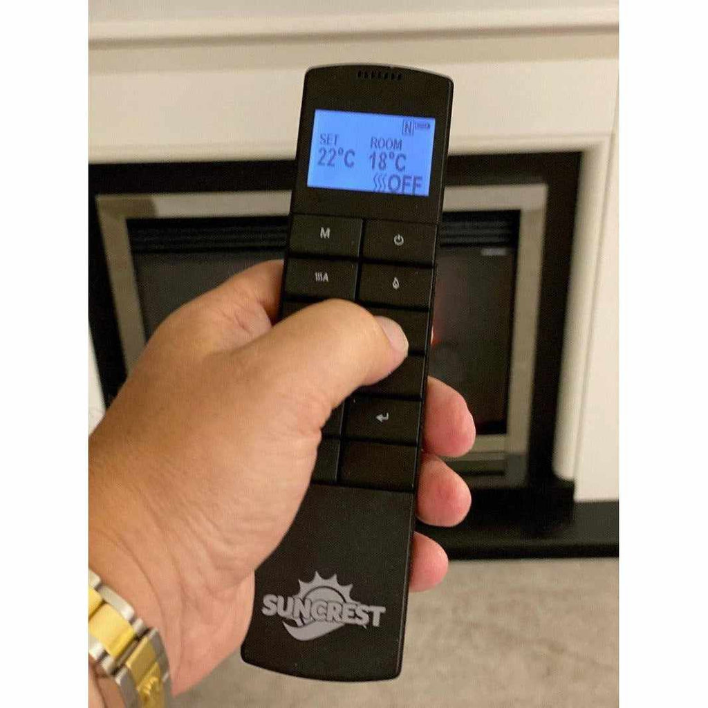Black Suncrest Antigua Electric Fireplace suite remote control with a blue backlit digital display screen.