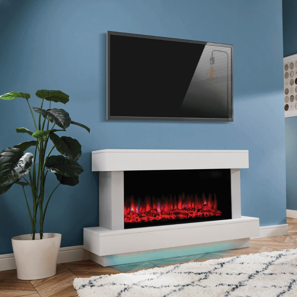 Suncrest Bourne Electric Fireplace suite in white with a glowing red flame effect and blue under-shelf lighting.