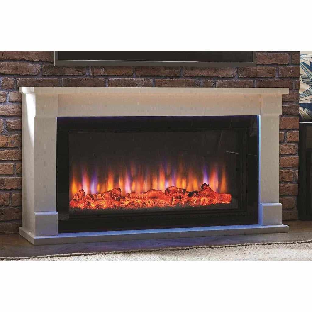 Suncrest Bradbury Ambience electric fireplace with a white surround and glowing log flame effect against a brick wall.