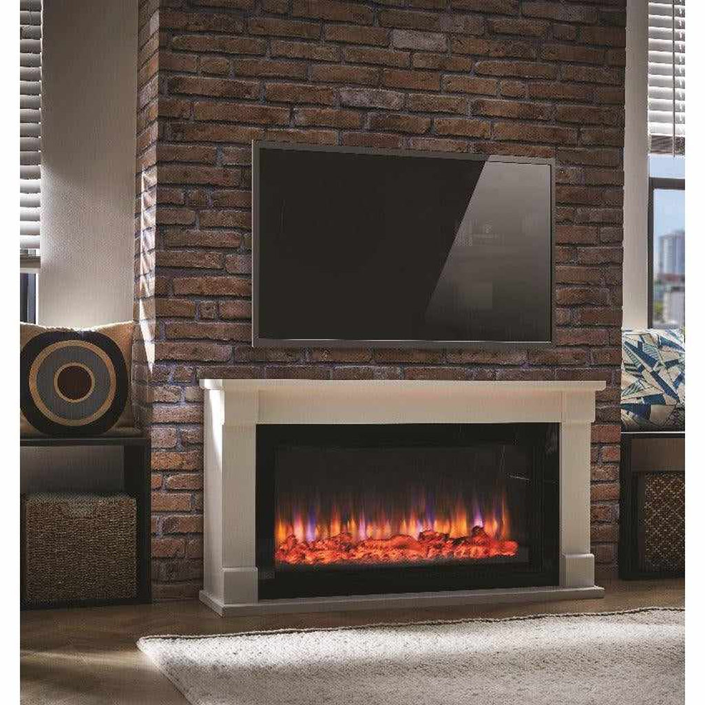 Suncrest Bradbury electric fireplace suite with a white surround and glowing flame effect against a brick wall.