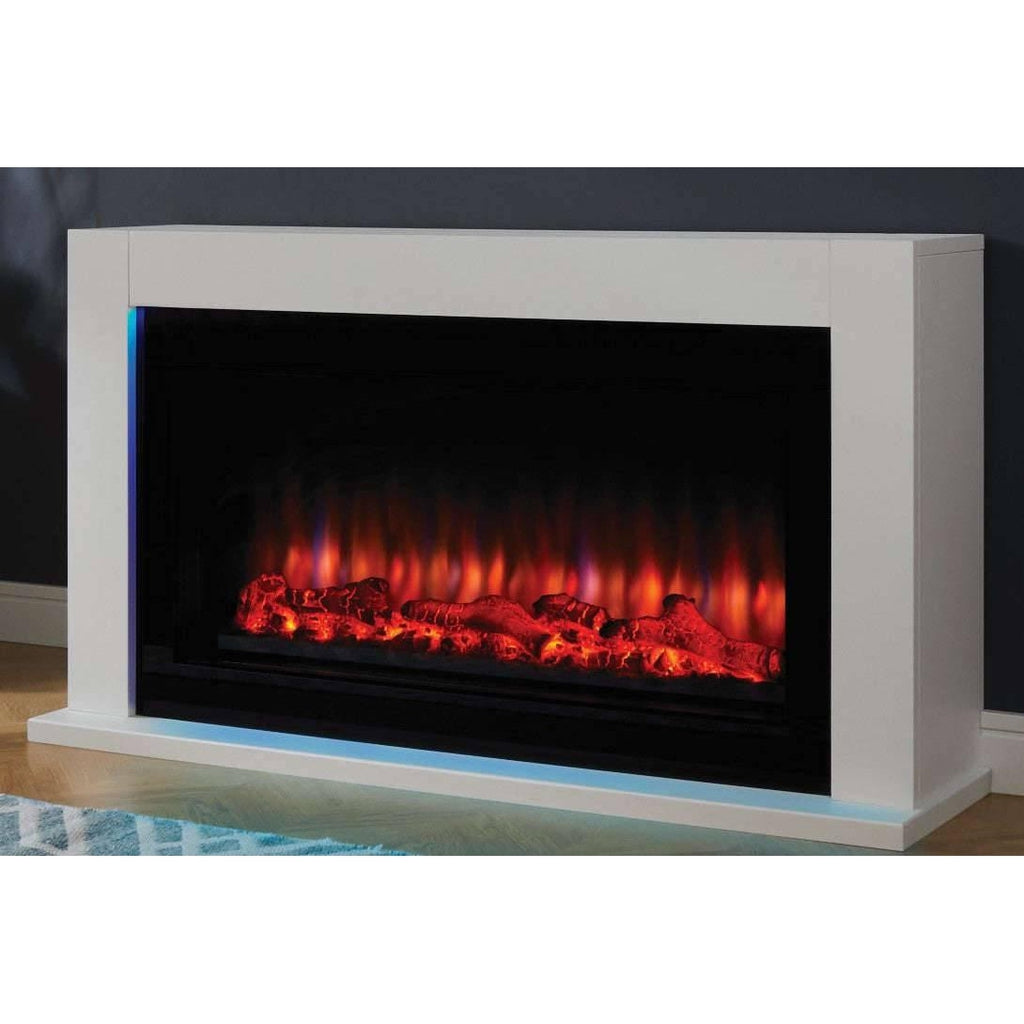 Suncrest Lumley-Ambience electric fireplace in white with a black firebox, glowing log effect, and blue LED side lighting.