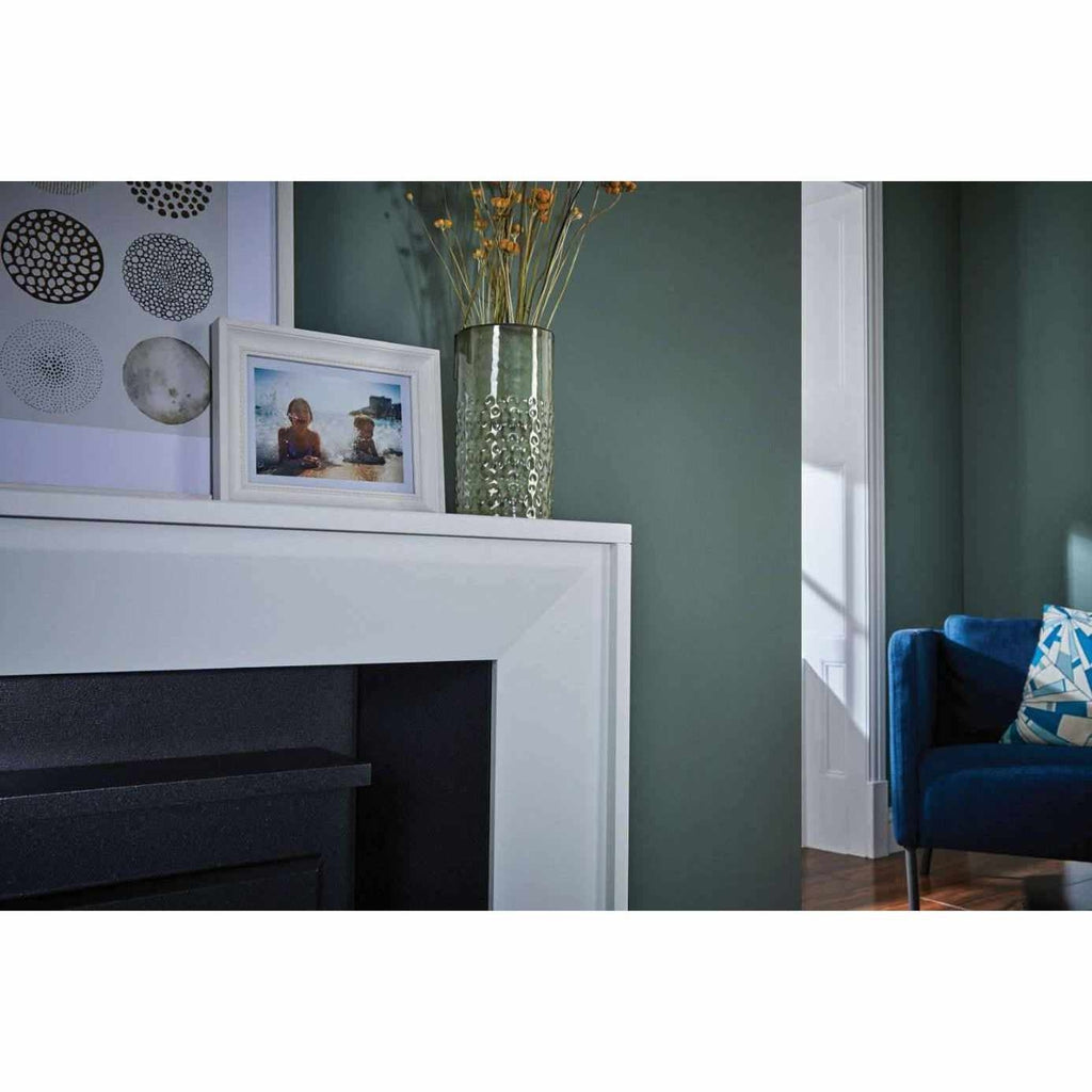 Suncrest Mayford Electric Stove Suite in white with a black interior, set against a dark green wall.